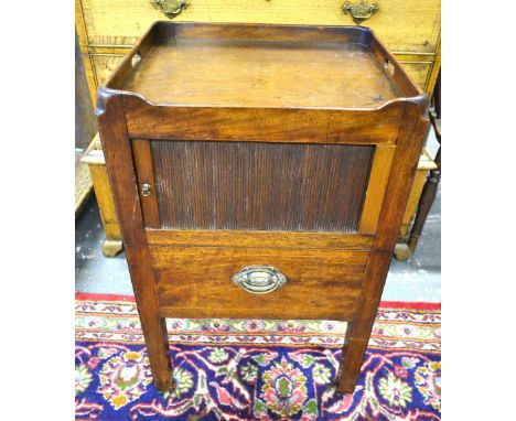 A George III mahogany tray top commode with tambour door over a bidet drawer, raised on square legs
