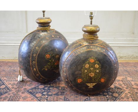 A pair of large Anglo-Indian polychrome decorated flat ovoid bottles converted to lamp bases, c/w shades, the bodies 57 cm hi