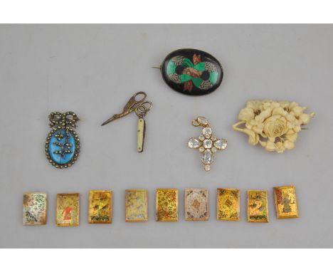 A collection of antique jewellery items including gilt metal white paste set Victorian cross, cut steel and blue porcelain br