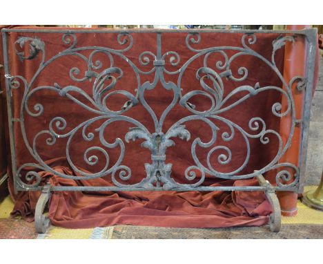 An 18th/19th century wrought iron panel mounted as a fire screen, 97 cm high x 52 cm