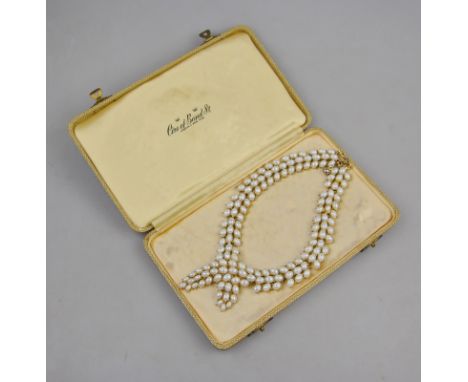A vintage three row imitation pearl cross over necklace in Ciro of Bond Street box