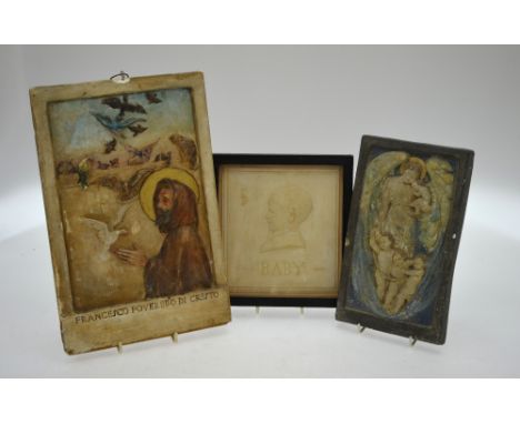 A ceramic tile with relief profile of a young boy inscribed 'Baby' and signed with initials ED, 17 x 16 cm, framed and glazed