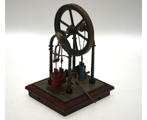 An engineers scale model live steam engine based on the Tubal Cain design, the 14 cm dia. spoked flywheel raised on four turn