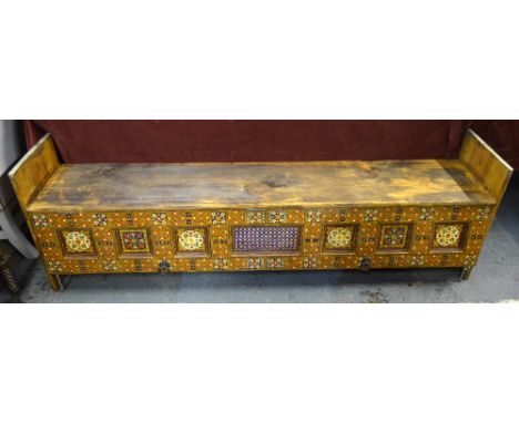 An antique hardwood low storage cupboard/bench seat, Belouchistan (now borders of Pakistan/Afghanistan) the highly decorated 