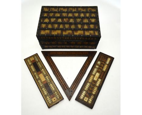 An Indian ebony and porcupine quill box fitted with a tray of lidded compartments, to/w three inlaid cribbage-boards (one tri