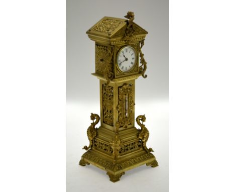 A brass miniature longcase clock with 8-day drum movement, the trunk incorporating a thermometer, the case stamped Reg.28957,