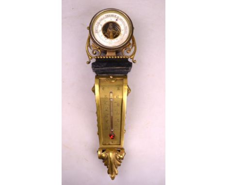 A 19th century French drum barometer mounted on a scrolling brass wall bracket, the white enamelled dial over a vertical ther