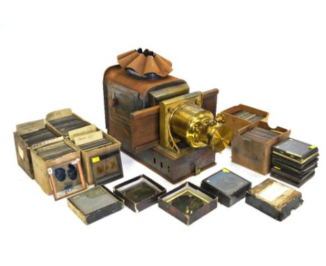 A brass and tin magic lantern 'The New Pamphengos' by W C Hughes of London (boxed), to/w a quantity of magic lantern slides -