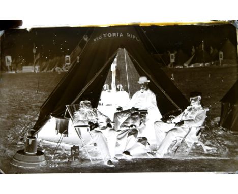 An interesting collection of glass negative plates, including a box of 8 x 5 plates, the box branded Murray & Heath, London, 