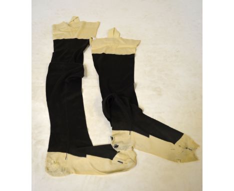 A pair of Queen Victoria's silk stockings bearing crown emblem and 'V R' to the tops dating from the 1870's  Condition Report
