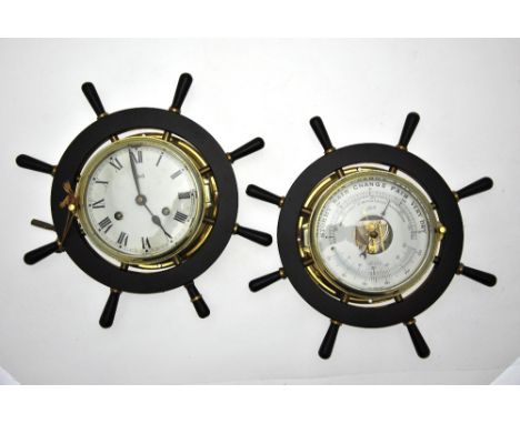 Schatz, a German nautical styled bulkhead clock within a ships wheel mount to/w a companion Schatz Holostenic compensated bar