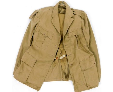 A 20thC army khaki dress jacket and trousers, size unknown.