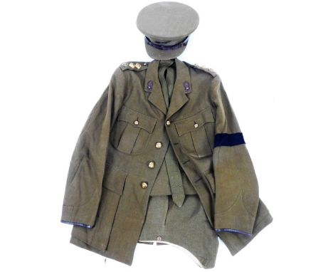 A 20thC army jacket, quarter length with buttons and shoulder epaulettes and peak cap.