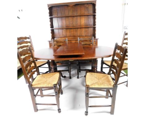 A Stewart &amp; Shacklock oak dining room suite, comprising of D end extending table with one leaf, on twin cabriole pedestal
