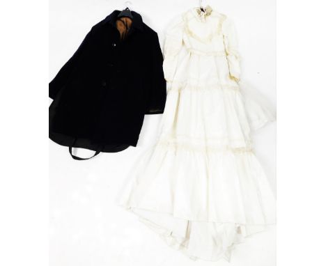 A vintage wedding dress, and a gentleman's three quarter length cashmere coat in navy blue. 