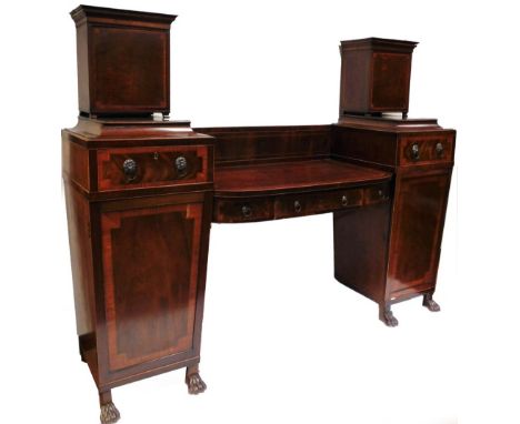 An early 19thC mahogany sideboard, in the manner of Thomas Hope, with a pair of partially inlaid cupboards raised above two s