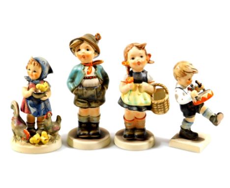 Various Goebel Hummel figures, boy singing, 16cm H, drummer boy, etc. printed marks beneath.  (4)