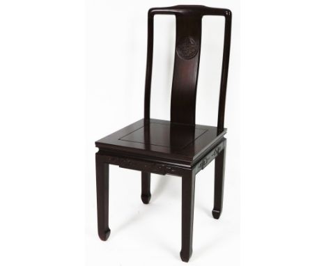 A 20thC Chinese hardwood dining chair, with shaped vertical splat set with a carved orb, on square seat, above square legs te