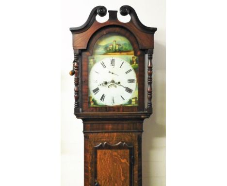 A 19thC oak and mahogany country longcase clock, with a swan neck pedimented hood, with turned supports, short carved trunk d