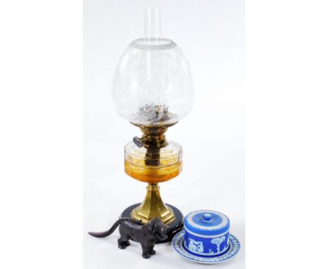 An early 20thC oil lamp, with clear glass funnel, frosted and clear glass shade decorated with flowers, brass stem, clear gla