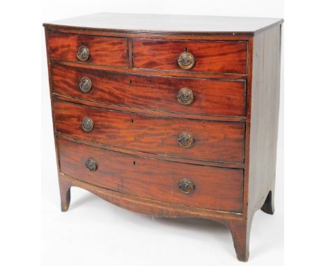 An early 19thC mahogany bow front chest, of two short and three long drawers, each with oval plate back swan neck handles, on