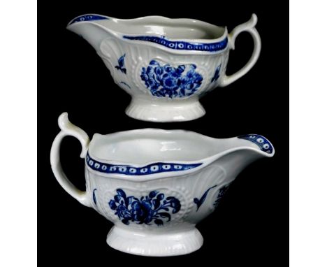 A pair of Worcester sauce boats, c1780, painted with the Floral pattern, 16cm W.