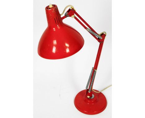 A mid 20thC vintage Bauhaus style angle poise lamp in orange, with cone shade, on adjustable stem and circular foot, the shad