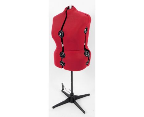 A late 20thC mannequin in red, on adjustable stand, 131cm H.