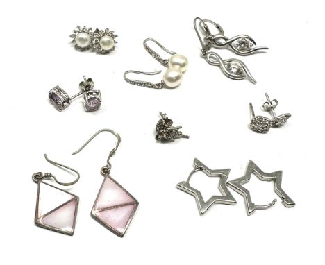 8 pairs of vintage silver earrings