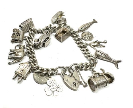 Vintage silver charm bracelet inc opening charms weight 71g