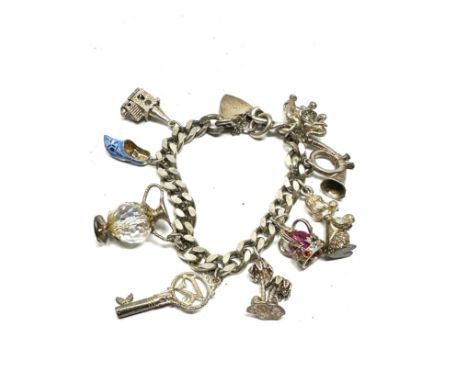 Vintage silver charm bracelet and charms weight 65g