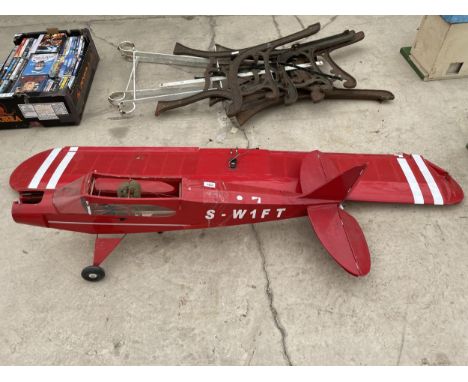 A MODEL AREOPLANE WITH NO ENGINE AND REQUIRING RESTORATION 