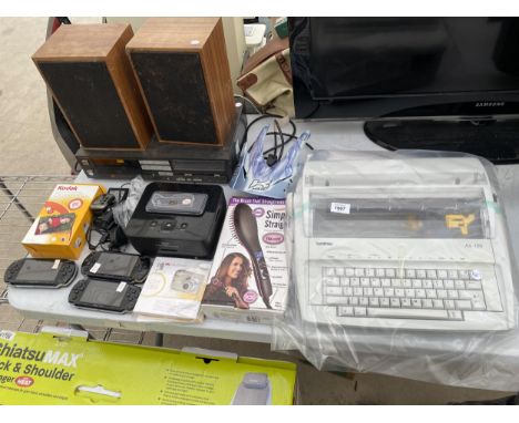 AN ASSORTMENT OF ITEMS TO INCLUDE SPEAKERS, THREE PSP GAMES CONSOLES AND A BROTHER TYPEWRITER ETC 