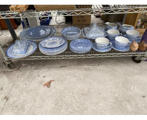 A LARGE ASSORTMENT OF CERAMIC WARE TO INCLUDE MAINLY BLUE AND WHITE PLATES, CUPS AND SAUCERS AND BUTTER DISH ETC 