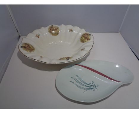 A STAFFORDSHIRE IRONSTONE DISH IN A PHEASANT DESIGN AND A CARLTONWARE SERVING DISH 