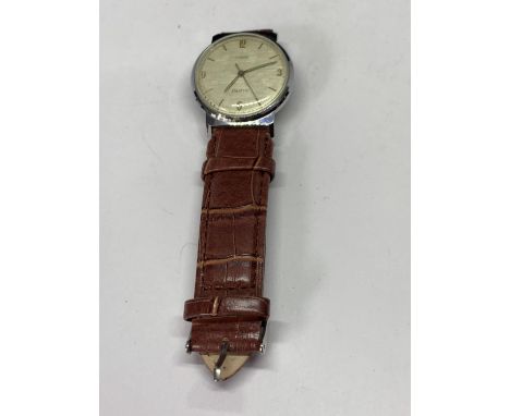 A TIMEX ELECTRIC AUTO WRISTWATCH WITH BROWN LEATHER STRAP SEEN WORKING BUT NO WARRANTY 