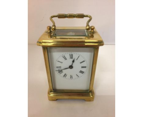 A BRASS CARRIAGE MANTLE CLOCK 