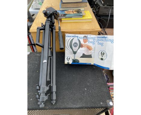 AN EXECUTIVE PUNCH BAG AND A CAMERA TRIPOD 