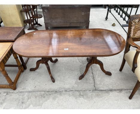 A MAHOGANY AND CROSSBANDED COFFEE TABLEON A DOUBLE TRIPOD BASE 