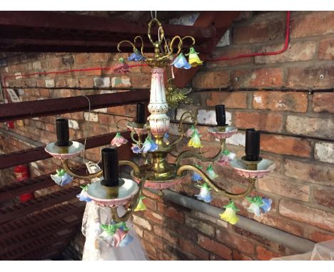 AN ORNATE CEILING LIGHT FITTING WITH CERAMIC FLOWER DECORATION 