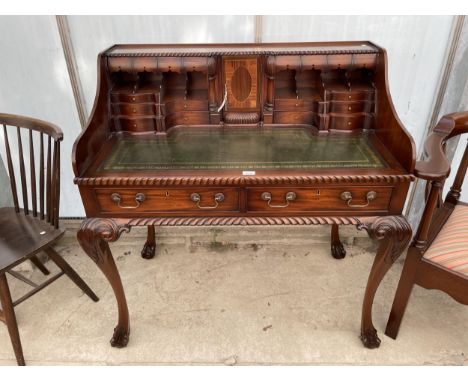 A CHIPPENDALE STYLE WRITING BUREAU WITH THIRTEEN DRAWERS, SMALL CUPBOARD AND INSET LEATHER TOP ON CABRIOLE LEGS, WITH BALL AN