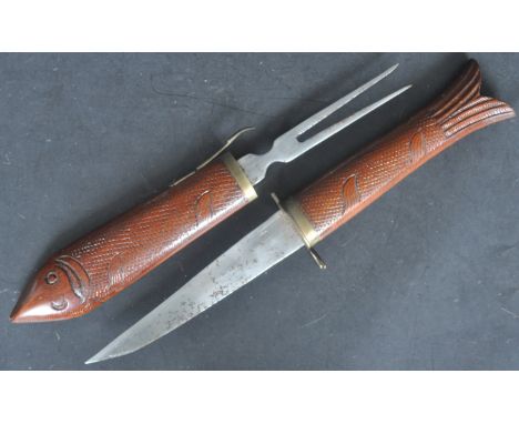 An early 20th century Indian wooden fish scabbard knife and fork serving set. The knife and fork being forged in steel and he