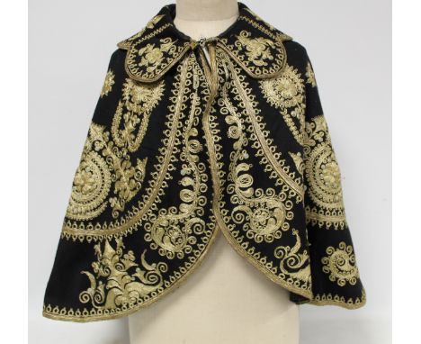 Vintage Spanish bull fighter's cape and matching waistcoat, the black felted wool profusely embroidered with metallic gold th