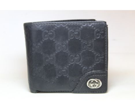 Vintage black leather Gucci wallet with embossed double G lattice pattern and double G metal mount, 9.5cm x 10cm, worn condit
