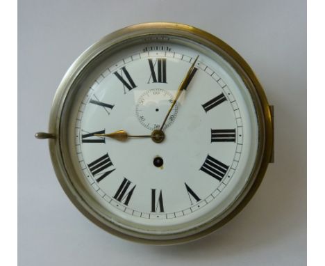 Early 20th century nautical cabin timepiece with enamel dial, in brass case for surface fitting. 23cm. 