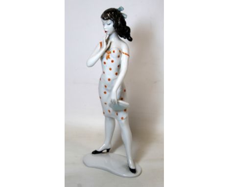 German Unterweissbach mid 20th century porcelain figure of a girl by K. Steiner. 25cm high.
