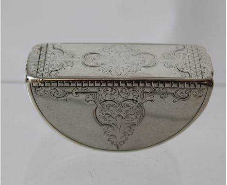 Early 18th century silver tumbling snuff box of semicircular shape with engraved arabesques, apparently unmarked.&nbsp; 