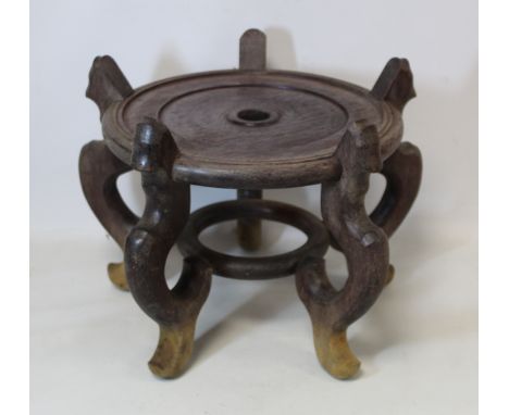Large Chinese hardwood stand, the circular top with five scroll feet and ring support below, to fit base 24.5cm diam., 27cm h