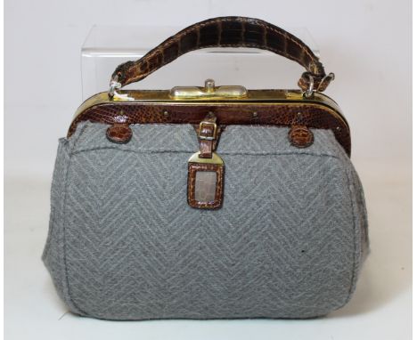 Vintage early 20th century brown lizard skin handbag with brass metal mounts, fixed loop handle with miniature matching lugga