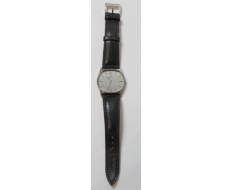 Gent's Zenith stainless steel watch, manual, with almost oval dial on strap, c.1960. 